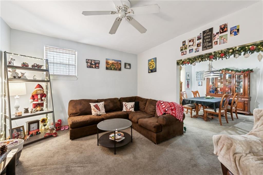 851 Hober Avenue McKees Rocks, PA 15136 - Photo 7 of 32 a living room with furniture a couch and a bookshelf