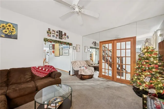 a living room with furniture and flowers