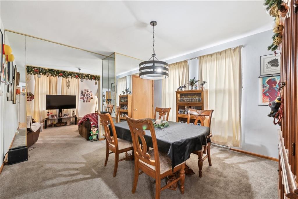 851 Hober Avenue McKees Rocks, PA 15136 - Photo 9 of 32 a dining room with furniture window and wooden floor