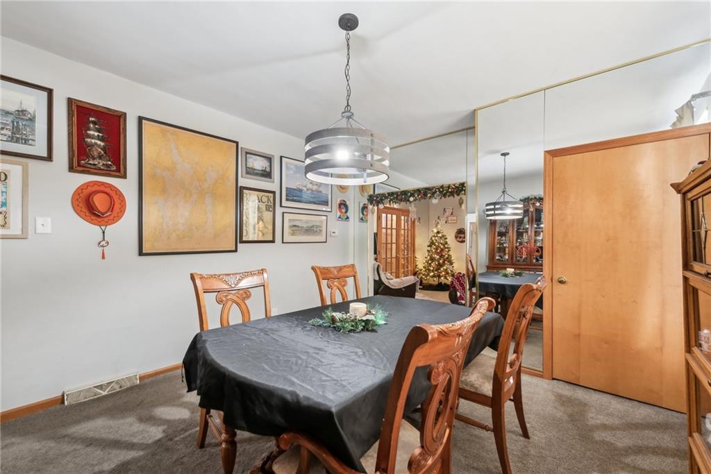 851 Hober Avenue McKees Rocks, PA 15136 - Photo 10 of 32 a view of a dining room with furniture and chandelier