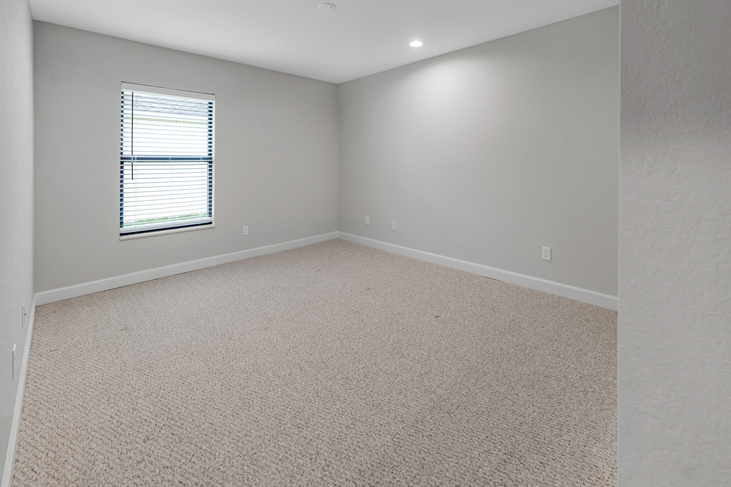 14533 Dulce Real Avenue Fort Pierce, FL 34951 - Photo 23 of 42 an empty room with a window