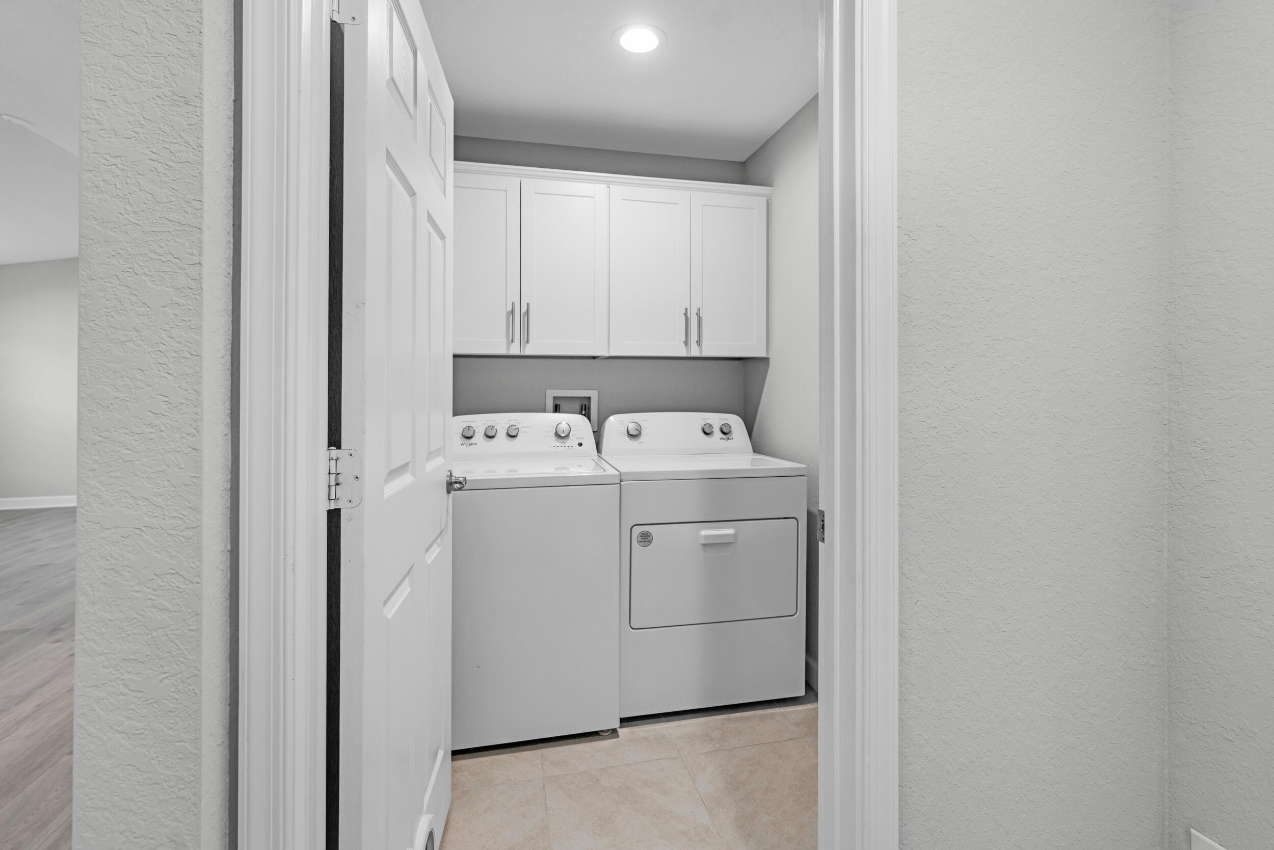 14533 Dulce Real Avenue Fort Pierce, FL 34951 - Photo 29 of 42 a utility room with dryer and washer