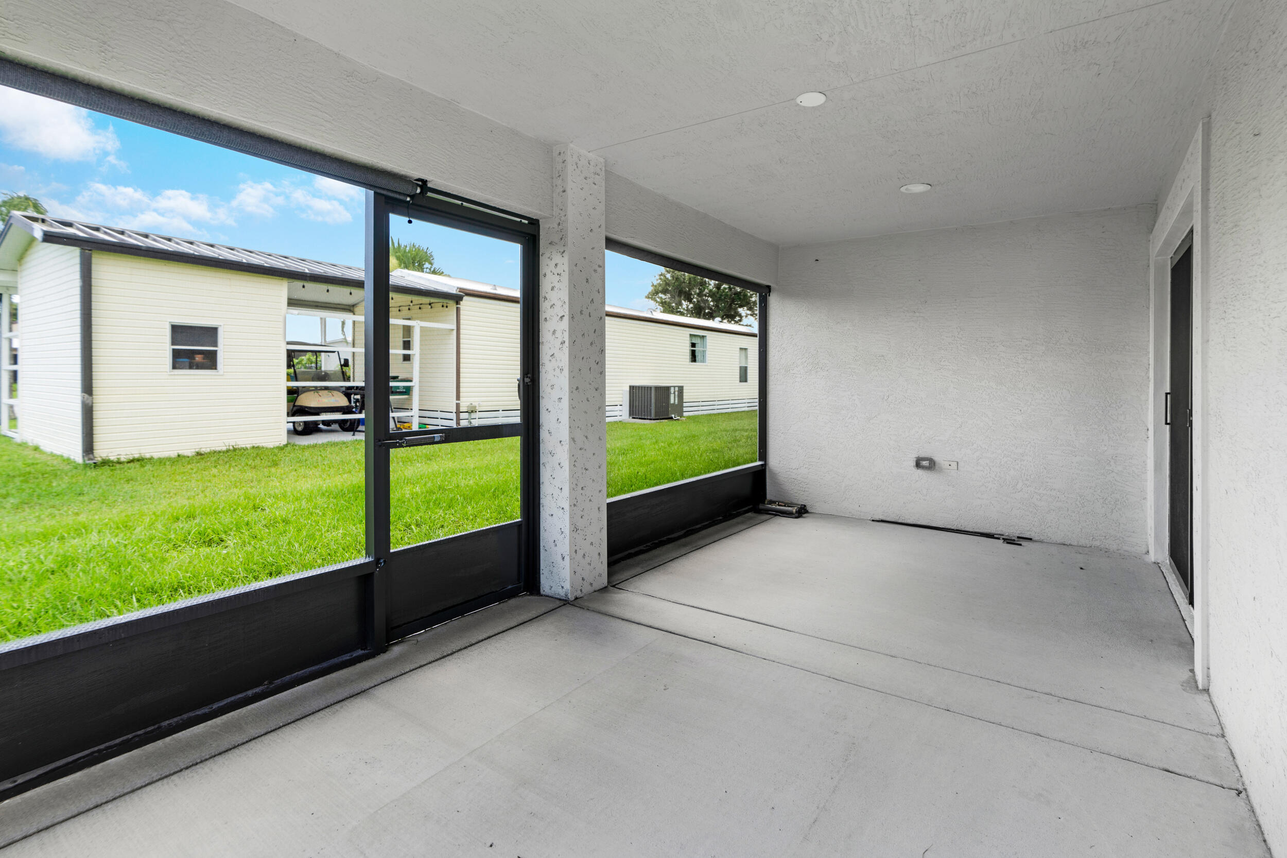 14533 Dulce Real Avenue Fort Pierce, FL 34951 - Photo 33 of 42 a view of an interior & kitchen with a large window