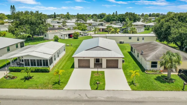 a aerial view of a house with a yard