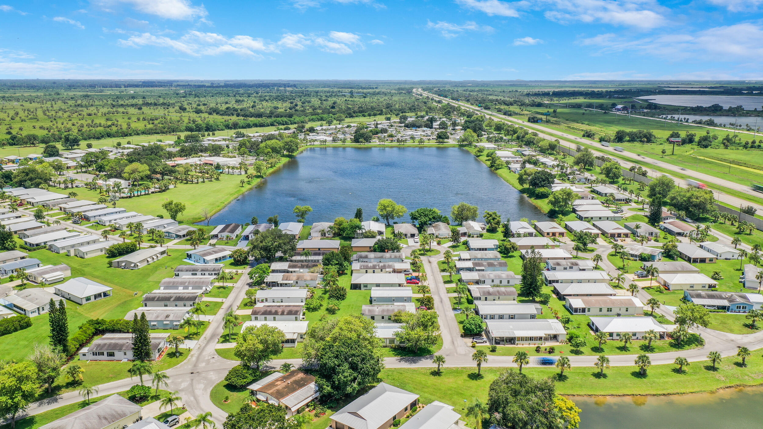 14533 Dulce Real Avenue Fort Pierce, FL 34951 - Photo 42 of 42 an aerial view of residential houses with outdoor space and river