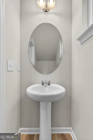 a bathroom with a sink and mirror