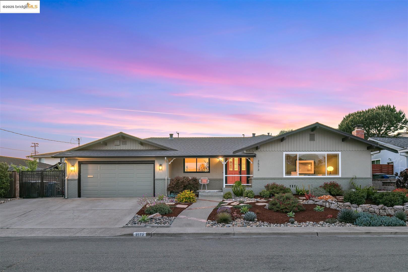 a front view of a house with garden