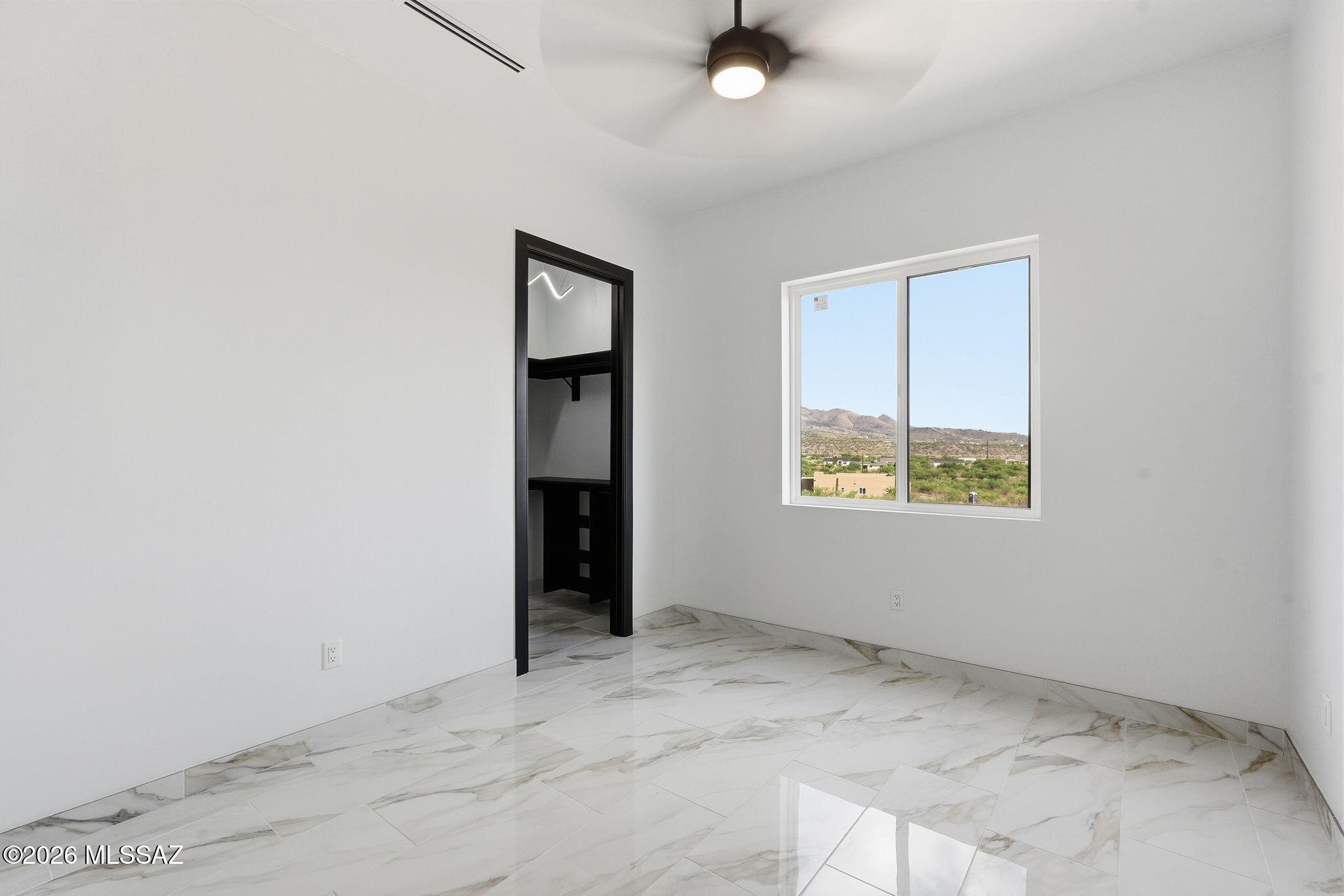 1786 Peralta Court Rio Rico, AZ 85648 - Photo 30 of 50 an empty room with a window