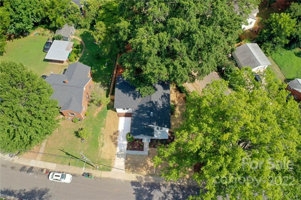 1321 Enderly Road Charlotte, NC 28208 - Photo 20 of 26 an aerial view of a house with a yard and tree s
