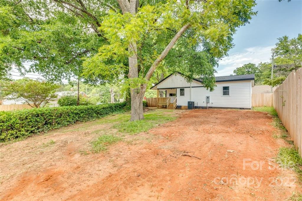 1321 Enderly Road Charlotte, NC 28208 - Photo 22 of 26 a front view of house with yard and trees