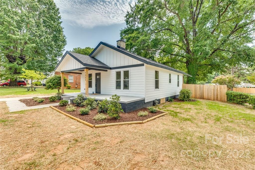 1321 Enderly Road Charlotte, NC 28208 - Photo 3 of 26 a view of a house with backyard and trees