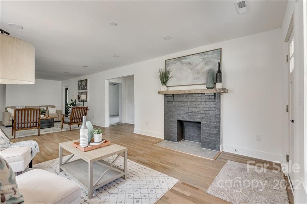 1321 Enderly Road Charlotte, NC 28208 - Photo 5 of 26 a living room with furniture and a fireplace