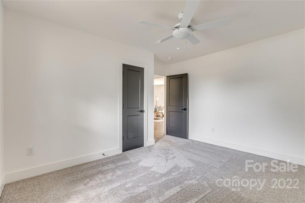 1321 Enderly Road Charlotte, NC 28208 - Photo 8 of 26 a view of an empty room with a ceiling fan