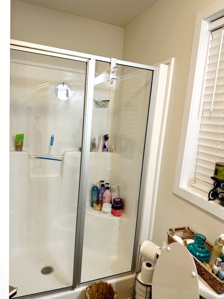 186 Northshore Road Elgin, IL 60123 - Photo 7 of 14 a bathroom with a shower and a mirror