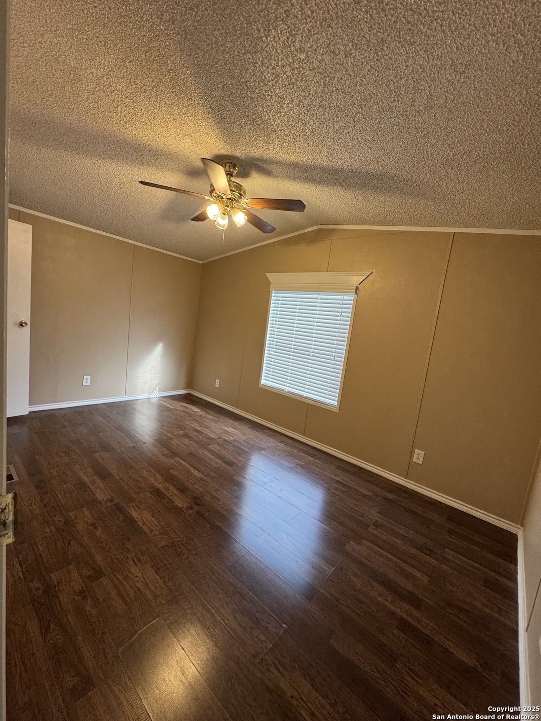 110 Deer Park Road, Unit B La Vernia, TX 78121 - Photo 2 of 12 wooden floor in an empty room with a window