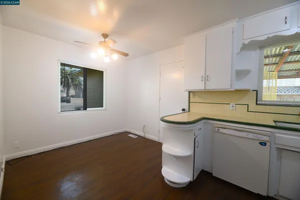 a kitchen with a sink cabinets and window