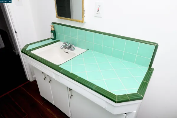 a bathroom with a sink and a mirror