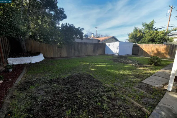 a backyard of a house with lots of green space