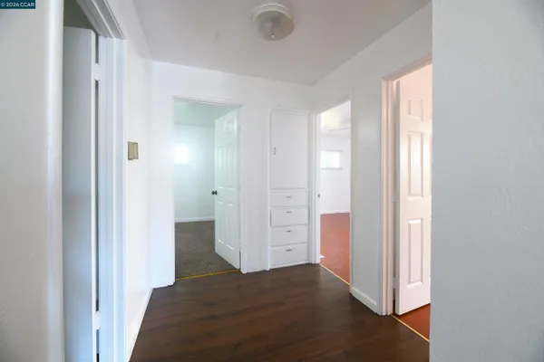 a view of a hallway with closet area