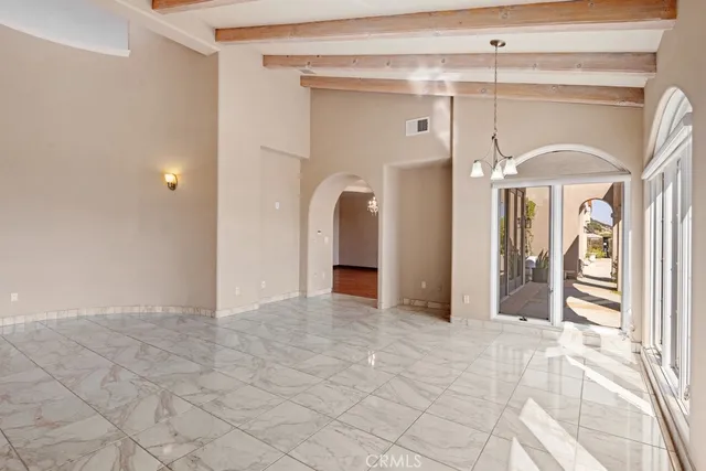 a view of a hallway with closet and entryway