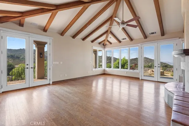 a view of an entryway with wooden floor