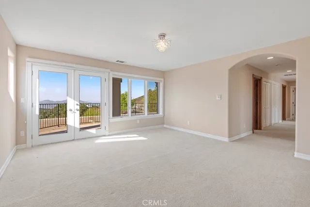 a view of an empty room with a balcony