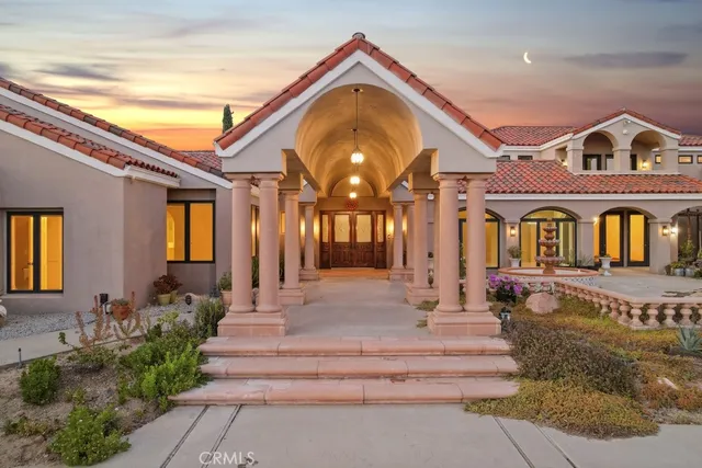 a view of a building with a yard