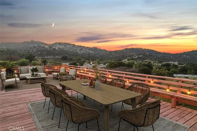 a view of city from terrace with seating area
