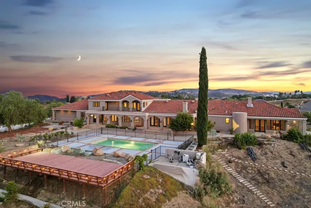 a city view with tall buildings and a yard