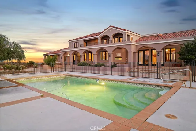a view of a house with swimming pool