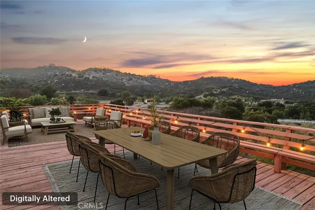a view of city from terrace with seating area