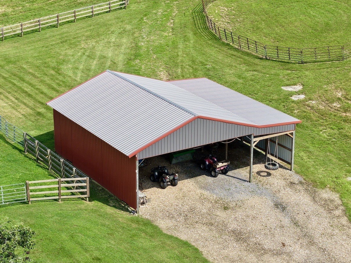 161 Fowler Road Woodbury, TN 37190 - Photo 11 of 69 a house with green field in front of it
