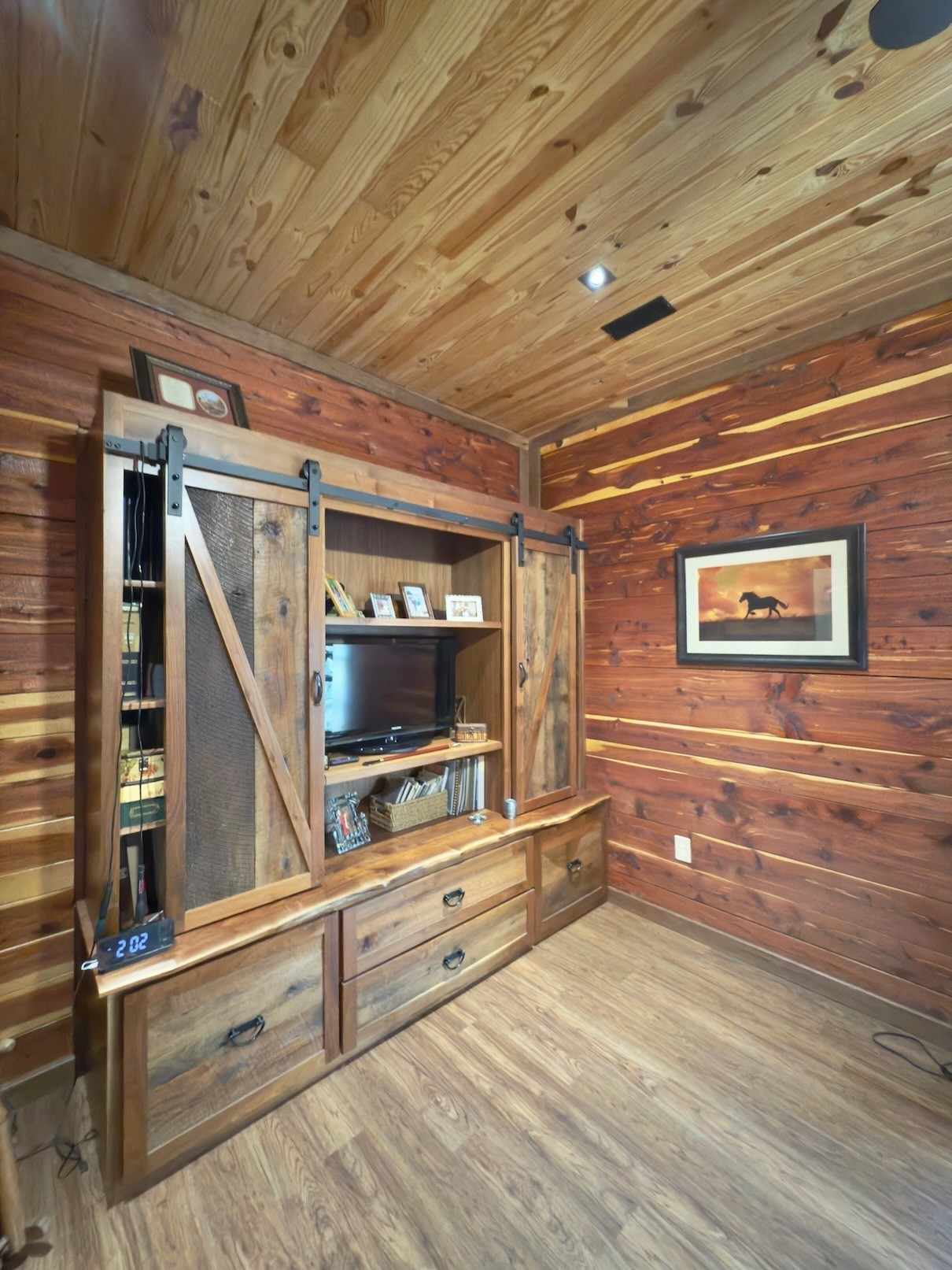 161 Fowler Road Woodbury, TN 37190 - Photo 33 of 69 a view of an empty room with wooden floor and furniture