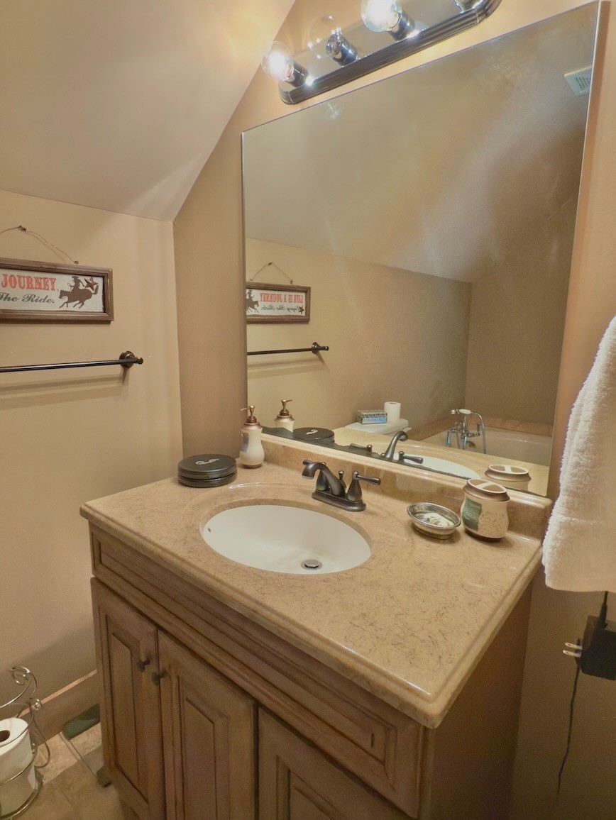 161 Fowler Road Woodbury, TN 37190 - Photo 36 of 69 a bathroom with a sink a vanity and a mirror