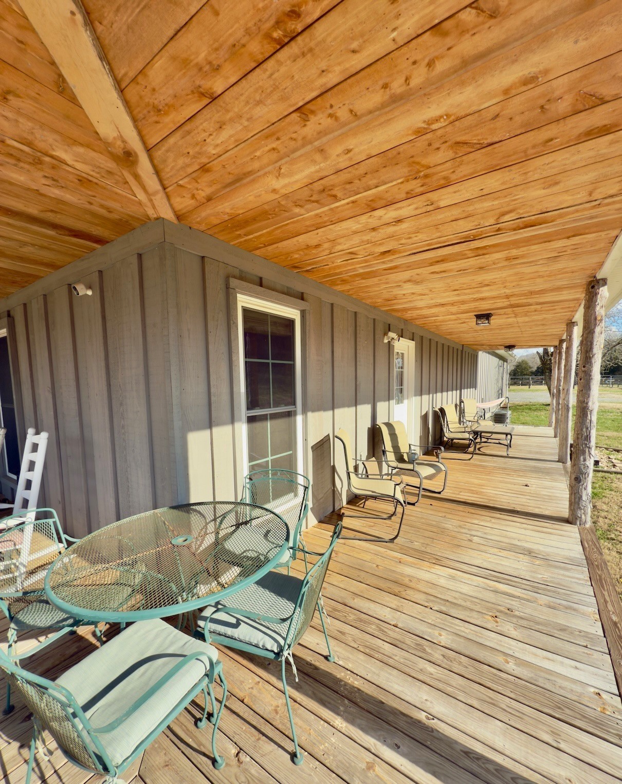 161 Fowler Road Woodbury, TN 37190 - Photo 47 of 69 a view of a patio with table and chairs with wooden floor and fence