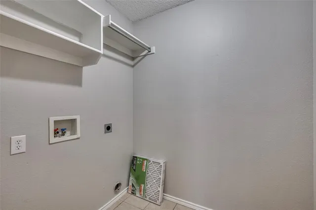a view of storage and utility room with a fan