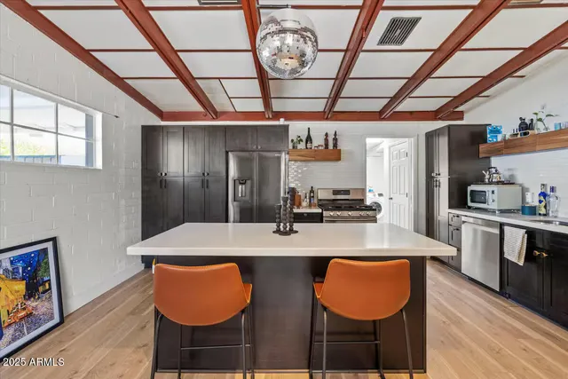 a view of a dining room with furniture wooden floor and a chandelier