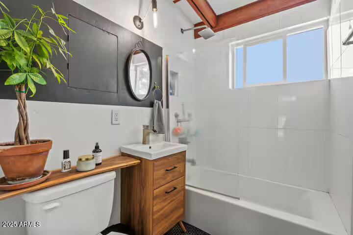 334 West Glenrosa Avenue Phoenix, AZ 85013 - Photo 6 of 9 a bathroom with a sink a mirror and a shower