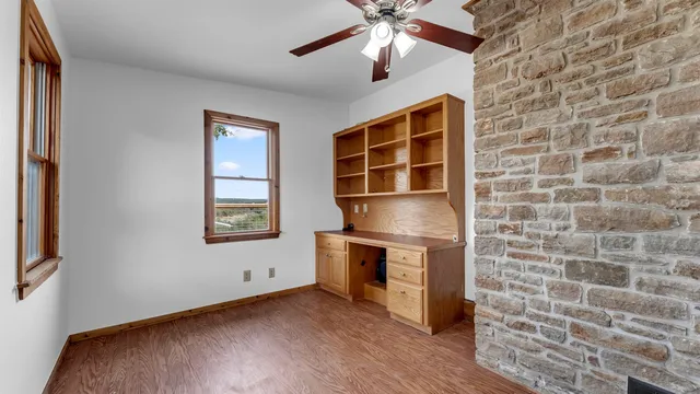a view of a hallway with chandelier