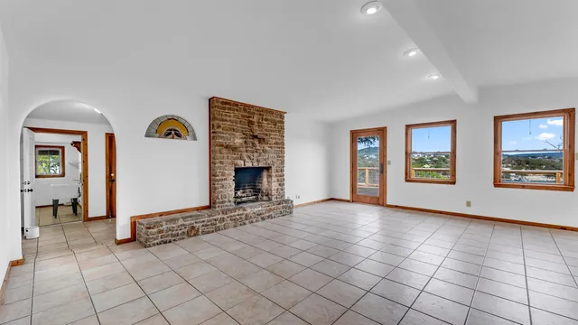 a view of a kitchen with furniture and an empty room