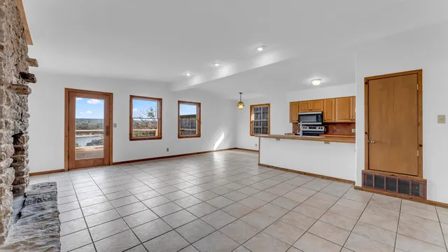 a kitchen with cabinets and a stove top oven