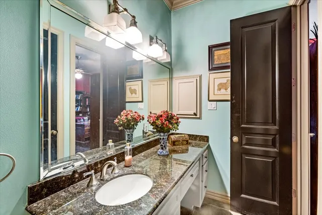 a balcony view with a large window and outdoor seating