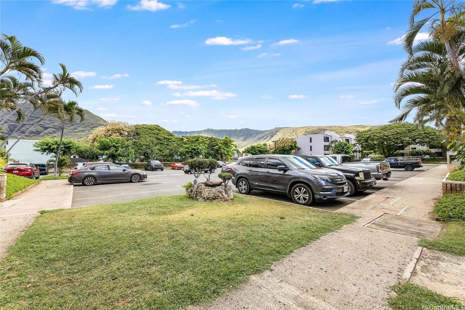 87-119 Helelua Street, Unit F202 Waianae, HI 96792 - Photo 25 of 25 a view of a street with cars parked