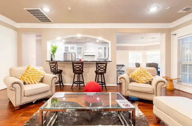 a living room with furniture and a large window