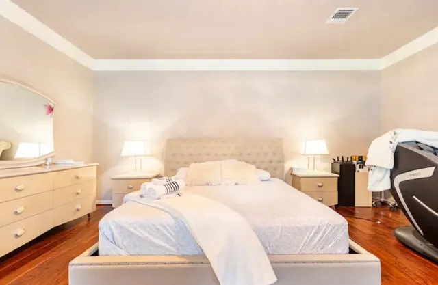 a bedroom with a bed and window