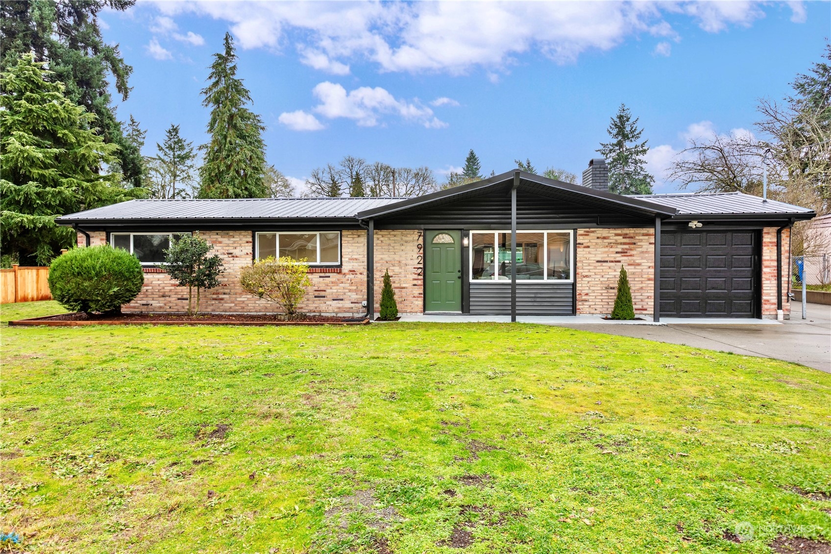 7922 Leschi Road Southwest Tacoma, WA 98498 - Photo 2 of 37 a front view of a house with garden