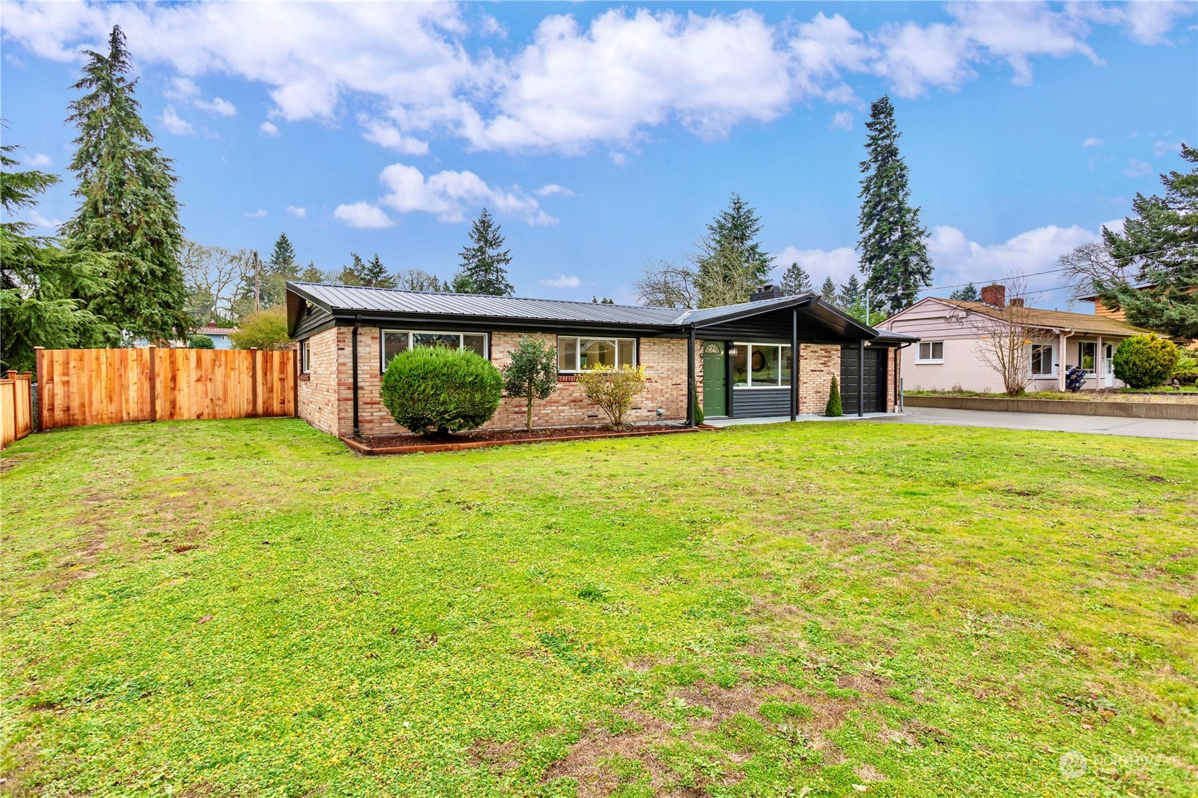 7922 Leschi Road Southwest Tacoma, WA 98498 - Photo 3 of 37 a front view of house with yard