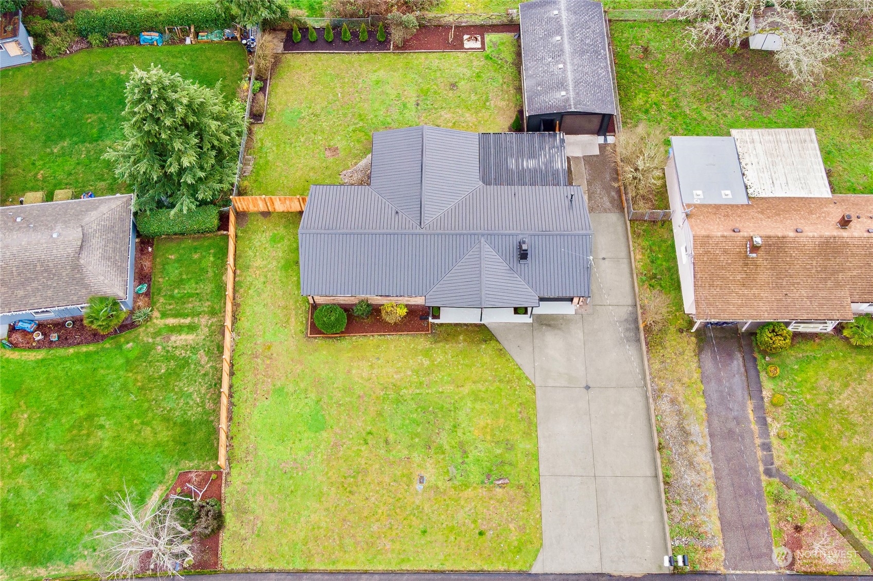 7922 Leschi Road Southwest Tacoma, WA 98498 - Photo 36 of 37 an aerial view of a house with a swimming pool