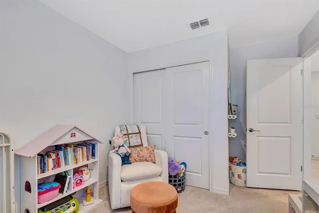 a room with furniture and a baby crib