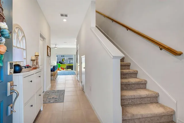 a spacious bathroom with a double vanity sink and mirror
